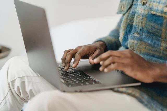 man using laptop and customer satisfaction guaranteed